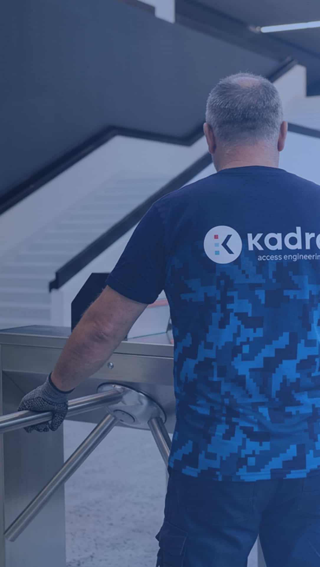 Kadra employee checking a modern access turnstile.