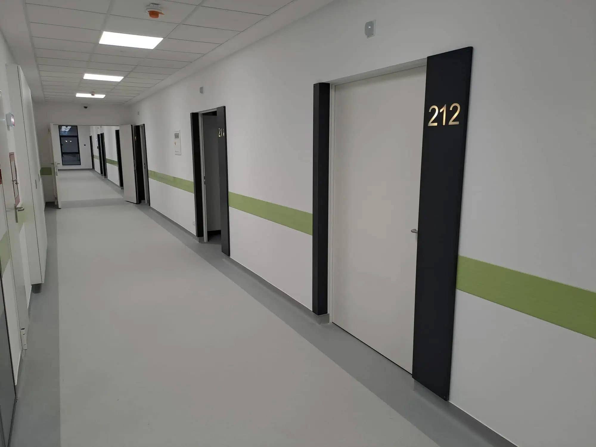 Modern hospital doors in the corridor of a Kadra medical center.