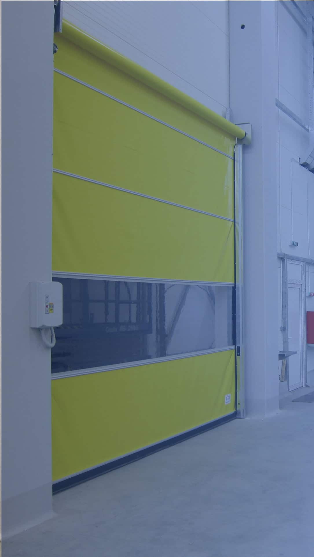 Industrial door and gate service — maintenance and repairs 1 Yellow industrial rapid door for commercial and industrial spaces.